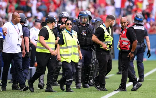 Security officials on the sidelines, prepared to take quick action in response to any issues