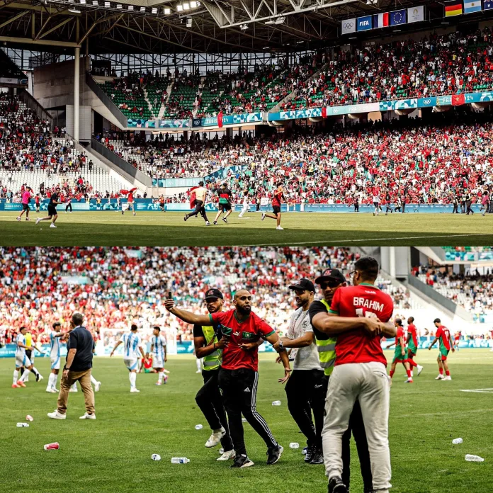 Fans storming the pitch during a soccer match, with security and players reacting to the unexpected intrusion