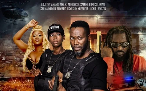 Samini in "The Storm Movie" : Promotional poster for the movie The Storm featuring Ghanaian music legend Samini as Ali Zafara. The poster displays a gritty urban background of Accra with Samini in the foreground, exuding a menacing presence. 