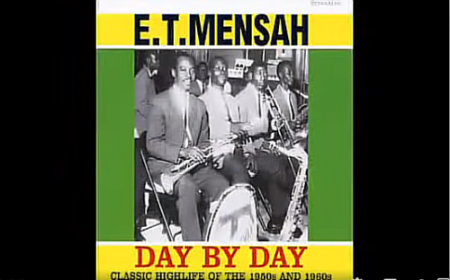 E.T. Mensah, the legendary 'King of Highlife,' performing on stage with his band, showcasing vibrant traditional attire and lively musical instruments, embodying the rich cultural heritage of Ghana and the energetic spirit of Highlife music.