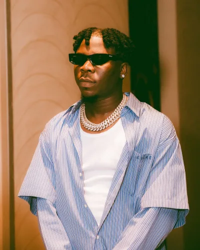 Stonebwoy poses with a calm and composed demeanor for the camera